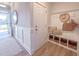 Inviting entryway with storage bench, decor, and natural light at 209 Pond View Ct # 4, Fuquay Varina, NC 27526
