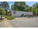 Metal building with gray asphalt parking lot and outdoor seating area at 209 Pond View Ct # 4, Fuquay Varina, NC 27526