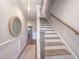 Hallway featuring stairs, hardwood floors, and neutral colors at 209 Pond View Ct # 4, Fuquay Varina, NC 27526