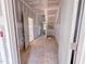 Unfinished hallway featuring open doorways and views of the home's interior, ready for customization and finishing touches at 209 Pond View Ct # 4, Fuquay Varina, NC 27526