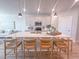 Bright, modern kitchen with large center island, bar stool seating and pendant lighting overlooking the living room at 209 Pond View Ct # 4, Fuquay Varina, NC 27526
