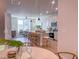 Open floor plan featuring kitchen with large island, pendant lights, stainless steel appliances, and cozy living room at 209 Pond View Ct # 4, Fuquay Varina, NC 27526