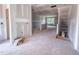 Large living room with multiple access points and natural light, awaiting personal touches to transform it into a home at 209 Pond View Ct # 4, Fuquay Varina, NC 27526