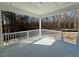 Covered back porch with white railings overlooking the backyard at 262 Grand Griffon Way, Lillington, NC 27546