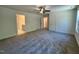Large bedroom with neutral carpet and doorways to other rooms in the house at 262 Grand Griffon Way, Lillington, NC 27546