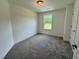 Bedroom with carpet, window and white walls at 262 Grand Griffon Way, Lillington, NC 27546