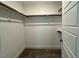 Walk in closet with wood shelving and door at 262 Grand Griffon Way, Lillington, NC 27546