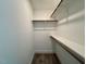 Walk in closet with wood shelving at 262 Grand Griffon Way, Lillington, NC 27546