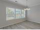 Bright dining room with hardwood floors and large windows at 262 Grand Griffon Way, Lillington, NC 27546