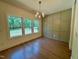 Dining room features hardwood floors, a decorative light fixture, and lots of natural light at 262 Grand Griffon Way, Lillington, NC 27546