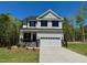 Charming two-story home with a well-manicured lawn and a two-car garage at 262 Grand Griffon Way, Lillington, NC 27546