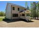 Side exterior elevation featuring a screened-in porch and neutral siding at 262 Grand Griffon Way, Lillington, NC 27546