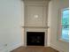Living room fireplace with detailed mantle, hardwood flooring and recessed lighting at 262 Grand Griffon Way, Lillington, NC 27546