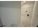Laundry Room featuring neutral walls, tiled floor, and wire rack for storage at 262 Grand Griffon Way, Lillington, NC 27546