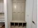 A well-organized mudroom features a coat rack and storage bench, offering a practical landing zone at 262 Grand Griffon Way, Lillington, NC 27546