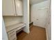 A well-organized mudroom with built-in desk, cubbies, and storage space, providing a convenient transition space at 262 Grand Griffon Way, Lillington, NC 27546