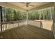 Cozy screened-in porch with wooden floors and views of the wooded backyard at 262 Grand Griffon Way, Lillington, NC 27546