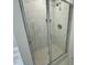 Walk-in shower featuring glass door and tiled walls at 262 Grand Griffon Way, Lillington, NC 27546