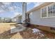 Back of the house features chimney, siding, and door to the backyard at 3332 Castlegate Dr, Raleigh, NC 27616