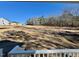 View of the level backyard and neighboring homes from the back porch at 45 Covey Rise Way, Lillington, NC 27546