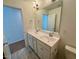 Bathroom featuring double sink vanity and tile floors at 45 Covey Rise Way, Lillington, NC 27546