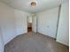 Neutral bedroom featuring carpeted flooring, a window, and white walls at 45 Covey Rise Way, Lillington, NC 27546