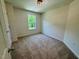 Neutral bedroom with carpet and a window overlooking the yard at 45 Covey Rise Way, Lillington, NC 27546