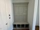 Built-in bench with storage cubbies in entryway at 45 Covey Rise Way, Lillington, NC 27546