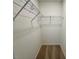 The bedroom closet has a wire shelf for organization and a neutral color palette at 45 Covey Rise Way, Lillington, NC 27546