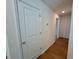 Hallway with hardwood floors and natural light at 45 Covey Rise Way, Lillington, NC 27546