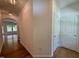 Hallway with hardwood floors, and white trim at 45 Covey Rise Way, Lillington, NC 27546