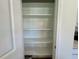 Pantry with several white shelves for plenty of storage at 45 Covey Rise Way, Lillington, NC 27546