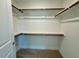 The walk-in closet is equipped with wood shelving for optimal storage space at 45 Covey Rise Way, Lillington, NC 27546