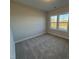 Spacious bedroom with carpet and large windows at 453 Edison Rail Ln, Knightdale, NC 27545