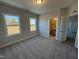 Spacious bedroom with ensuite bathroom and carpet flooring at 453 Edison Rail Ln, Knightdale, NC 27545