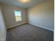 Simple bedroom with carpet and a window at 453 Edison Rail Ln, Knightdale, NC 27545