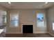 Fireplace with white mantel between two windows at 453 Edison Rail Ln, Knightdale, NC 27545