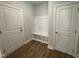 Convenient laundry area with built-in bench and cabinets at 453 Edison Rail Ln, Knightdale, NC 27545