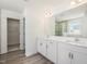 Bathroom featuring double sink vanity, a large mirror, and a separate shower room at 63 Whimbrel Ct, Lillington, NC 27546