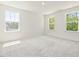 Bright bedroom features multiple windows that offer views of the surrounding landscape and natural light at 63 Whimbrel Ct, Lillington, NC 27546