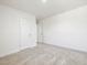 Cozy bedroom featuring neutral carpet and doors to other rooms at 63 Whimbrel Ct, Lillington, NC 27546