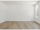 A bright, empty room features fresh paint, neutral flooring, and abundant natural light at 63 Whimbrel Ct, Lillington, NC 27546