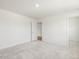 Bedroom features neutral carpet, ensuite bath, and walk-in closet at 63 Whimbrel Ct, Lillington, NC 27546