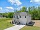 Charming two-story home boasts a well-maintained lawn and inviting front porch at 63 Whimbrel Ct, Lillington, NC 27546
