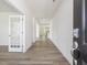 Bright foyer with wood-look floors, white walls, and a clear view to the home's interior at 63 Whimbrel Ct, Lillington, NC 27546