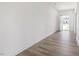 Bright foyer with light wood-look floors, white walls, and view of front yard at 63 Whimbrel Ct, Lillington, NC 27546