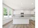 Open kitchen with a central island, granite countertops, and stainless steel appliances at 63 Whimbrel Ct, Lillington, NC 27546