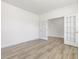 Bright office with wood-look floors, white walls and ceiling, and view to another room at 63 Whimbrel Ct, Lillington, NC 27546