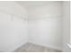Bright walk-in closet featuring wire shelving system at 63 Whimbrel Ct, Lillington, NC 27546