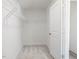 Walk-in closet featuring wire shelving and a neutral carpet, offering ample storage space at 63 Whimbrel Ct, Lillington, NC 27546